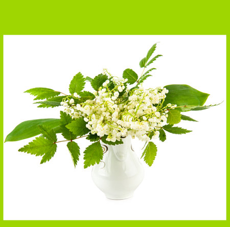 Bouquet of lilies of the valley in a vase isolated on a white background.の写真素材
