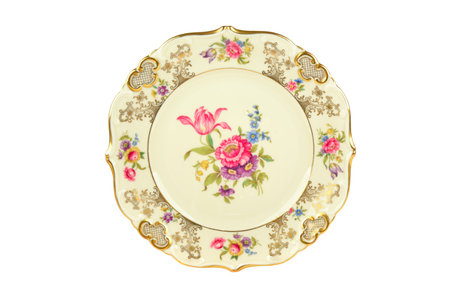 Vintage porcelain plate with traditional bouquet and luxurious pattern isolated on white background.の写真素材