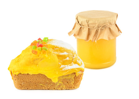 Cupcake honey and a jar of honey isolated on white background. Collage. Free space for text.の写真素材