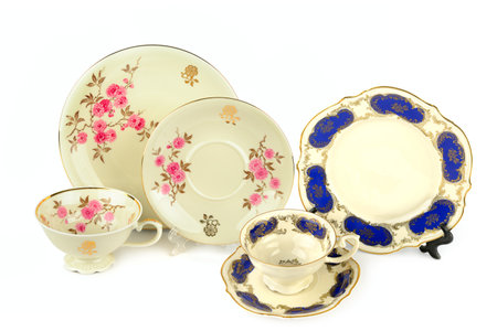 Set of Vintage porcelain cups and saucers isolated on white background. Collage.の写真素材