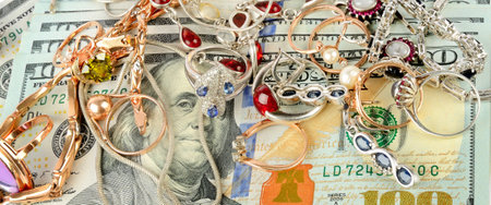 jewelry scrap of gold and silver and money, pawnshop concept, closeupの写真素材