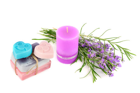 Soap and scented candles with lavender extract isolated on white background. Free space for text.の写真素材