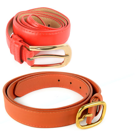 Set of Women's leather waist red belts with metal buckles isolated on white background. Collage. Free space for text.の写真素材