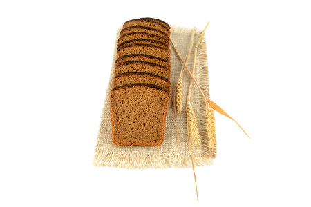 Bread and wheat isolated on white background.の写真素材