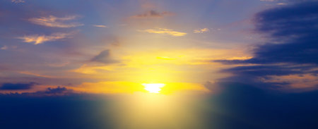 Cloudy sky and bright sunrise over the horizon. Wide photo.の写真素材
