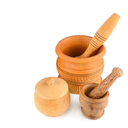 Set of wooden mortars and pestles isolated on white background. Free space for text.の写真素材