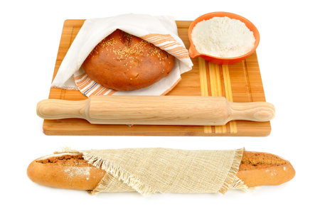 Freshly baked baguette, bread, flour and rolling pin isolated on white background. Collage.の写真素材