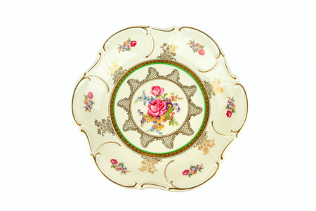 Vintage plate isolated on white background.の写真素材