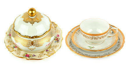 Vintage porcelain candy bowl, cup and saucer isolated on white background. Collage. Wide photo.の写真素材