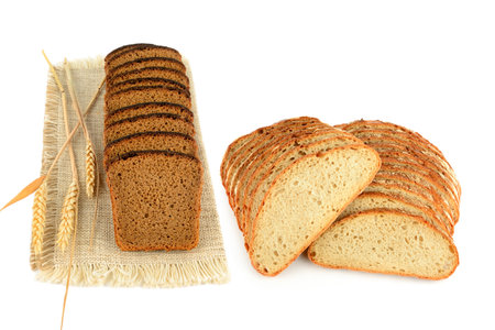 Sliced Freshly baked Bread isolated on white background. Bakery, rustic traditional food concept. Collage. Free space for text.の写真素材