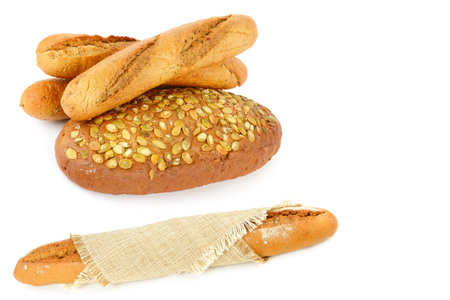Bread with pumpkin seeds and baguette isolated on white background. Collage. Free space for text.の写真素材
