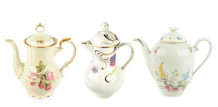 Elegant vintage porcelain coffee pots isolated on white background. Collage. Wide photo. Free space for text.の写真素材
