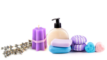 Lavender candle, shampoo, soap, oil and lotion, isolated on white background. Free space for text. Collage. Wide photo.の写真素材