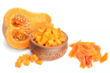 Pumpkin pieces, seeds and dried pumpkin pieces isolated on white background. Collage. Free space for text.の写真素材
