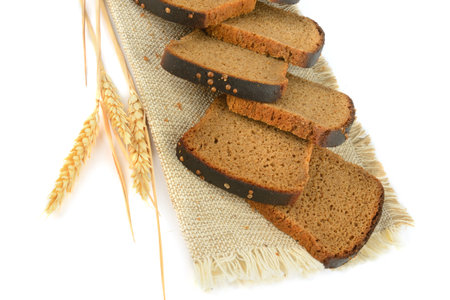 Sliced Freshly baked Bread isolated on white background. Bakery, rustic traditional food concept.の写真素材