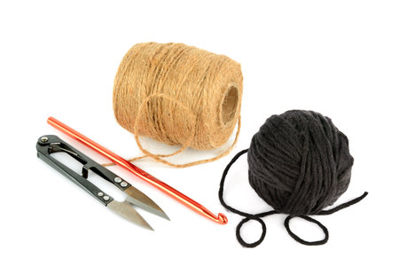 Balls of yarn, scissors and crochet hook isolated on white background. Collage.の写真素材