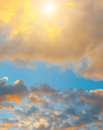 Beautiful sky background - Sunset (Sunrise) sky with light clouds. Vertical photo.