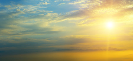 Beautiful sky background - Sunset (Sunrise) sky with light clouds. Wide photo.