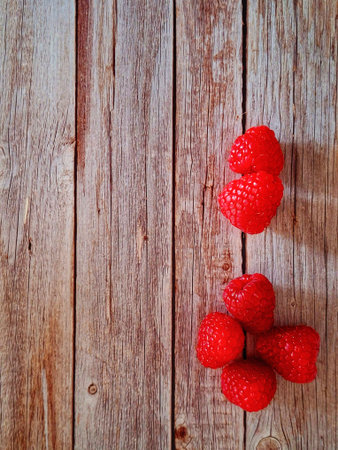 Raspberries on a wooden background. toning. selective focus