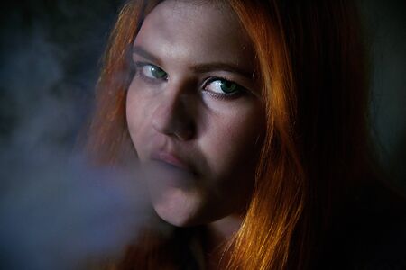 Woman and smokeの写真素材