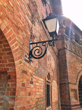 Lamp post street on brick wall backgroundの写真素材