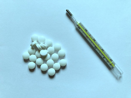 Medical pills isolated on blue background, clipping path included