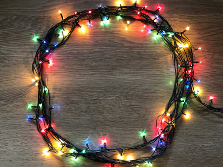 luminous garland on a wooden background