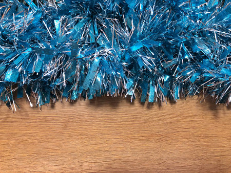 blue tinsel on a wooden background