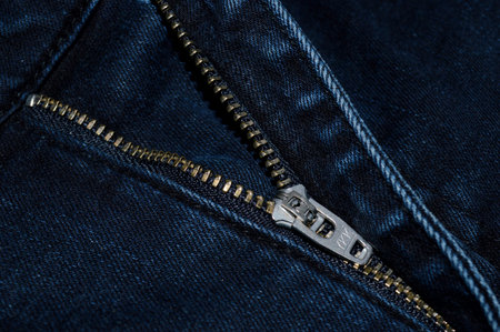 Close up of zipper on dark blue jeans