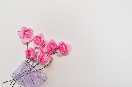 beautiful pink roses on wooden background with space for text