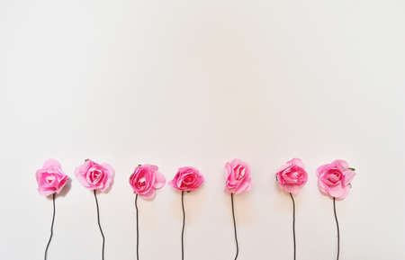 beautiful pink roses on wooden background with space for text.の写真素材