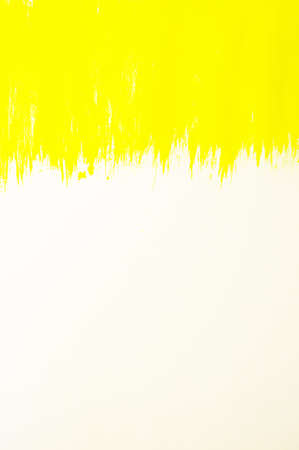 Yellow abstract hand-painted brush stroke daub background over vintage old paperの写真素材