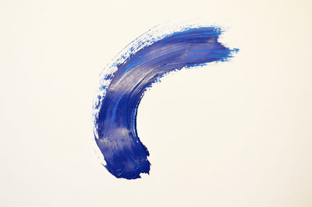 Blue watercolor paint stroke on white background