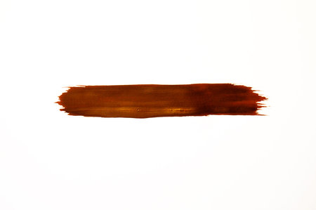 Smears of brown paint on a white background