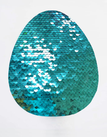 shiny sequins background. Egg on a white background. Easter egg