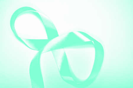 Photo for International Women's Day. On a white background, silhouette of the number eight, made with ribbon. Aqua Mentheの写真素材