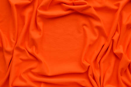 Orange fabric texture background, Orange fabric crumpled background, close up, Top viewの写真素材