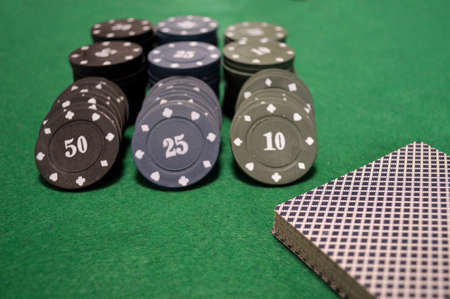Poker background - chips and cards on green tableの写真素材
