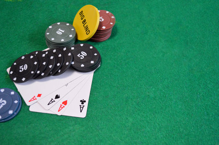 Poker background - chips and cards on green table