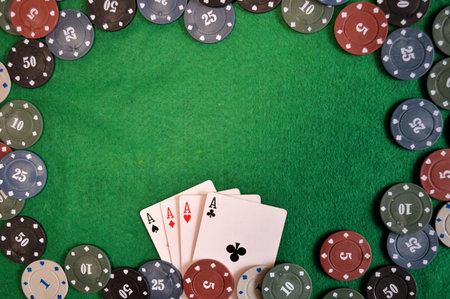 Poker background - chips and cards on green table