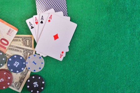 Poker background - chips, cards and money on green table