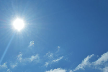 Sun in the blue sky. blue sky background with white clouds. international climate day. world...