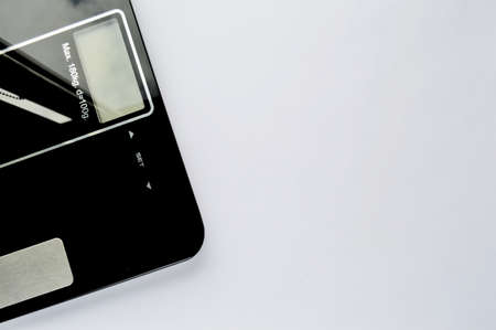 Dieting concept with scales isolated on the white backgroundの写真素材