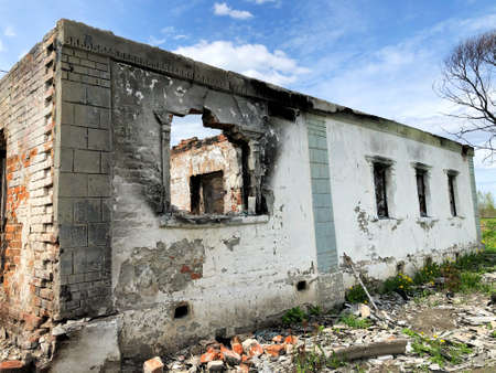 Burned house after fire, ruined building room inside, disaster or war aftermath conceptの写真素材
