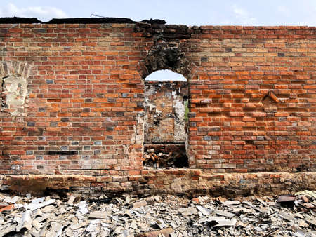 Burned house after fire, ruined building room inside, disaster or war aftermath conceptの写真素材
