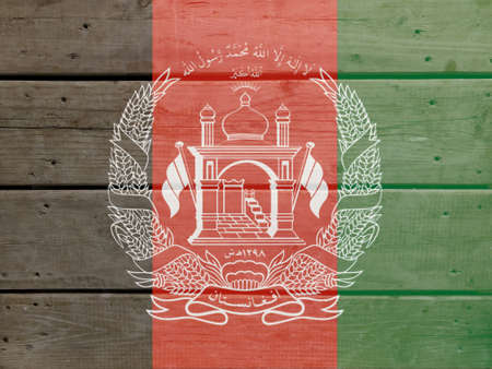 Afghanistan flag painted on wood plank background. Brushed natural light knotted wooden board texture. Wooden texture background flag of Afghanistanの写真素材