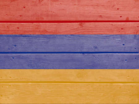 Armenia flag painted on wood plank background. Brushed natural light knotted wooden board texture. Wooden texture background flag of Armeniaの写真素材