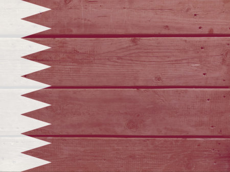 Qatar flag painted on wood plank background. Brushed natural light knotted wooden board texture. Wooden texture background flag of Qatarの写真素材