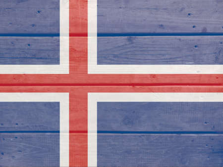 Iceland flag painted on wood plank background. Brushed natural light knotted wooden board texture. Wooden texture background flag of Icelandの写真素材