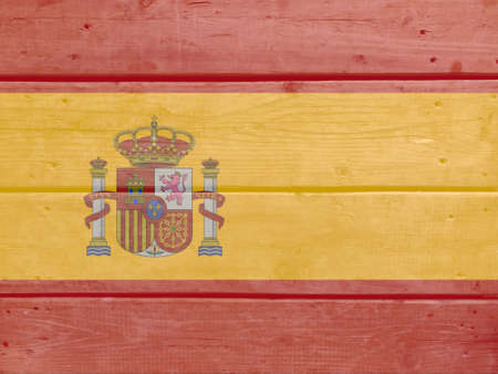 Spain flag painted on wood plank background. Brushed natural light knotted wooden board texture. Wooden texture background flag of Spainの写真素材